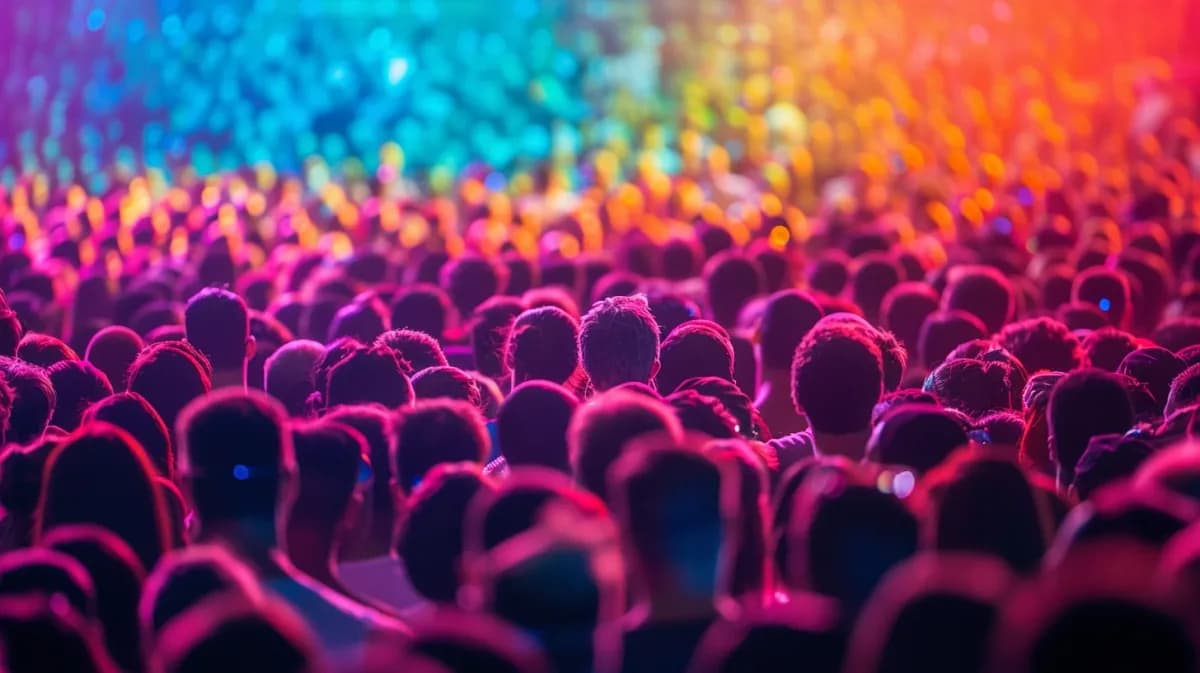 Vibrant crowd at a live event symbolizing a large, engaged audience symbolyzing build audience before product launch