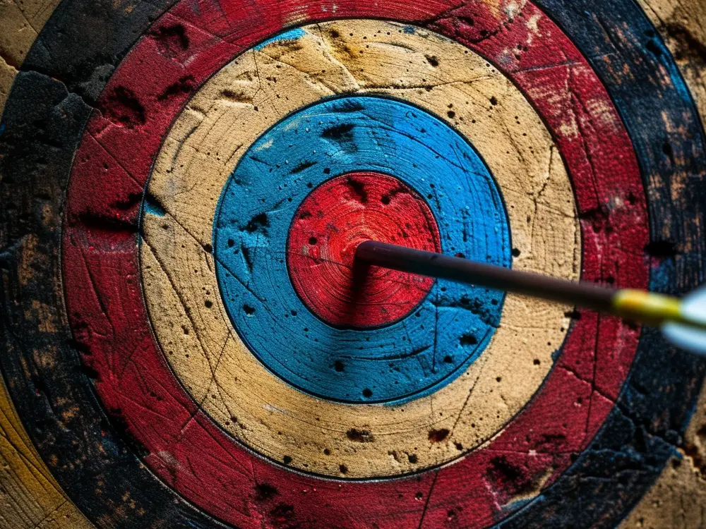 An arrow hitting a bullseye depicting the evaluation of a company's brand strategy.