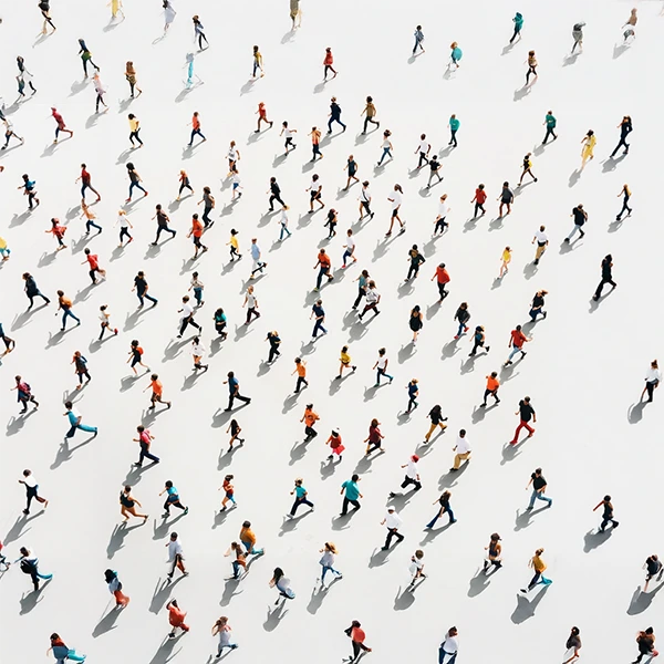 Aerial view of a diverse crowd walking in various directions, symbolizing the targeted and segmented approach of Via Marketing's email marketing services.